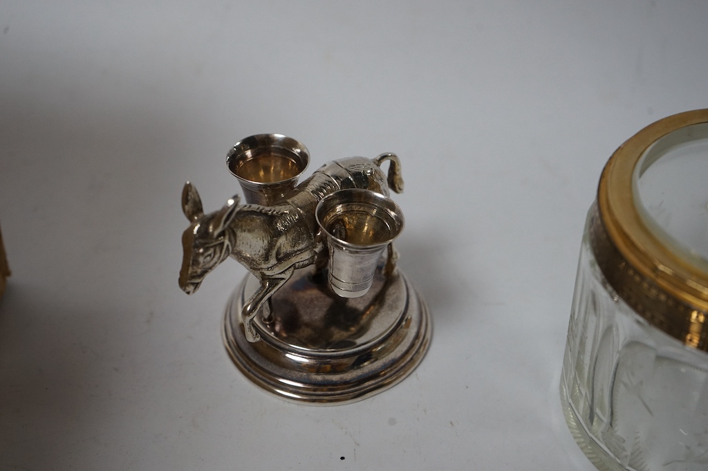 Assorted small silver including a small Reynolds Angels pin tray, Birmingham, 1900, 11.1cm, one other small dish, a modern mounted timepiece, a French mounted glass salts bottle, a photograph frame, a mounted glass whisk